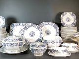 many different types of plates and bowls on the table
