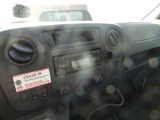 a car dashboard with a sticker that says covid on it
