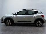 the silver nissan c - hr suv is parked in a garage