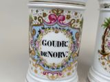 two vases that have been decorated with different designs