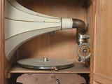 a wooden cabinet with a record player inside of it