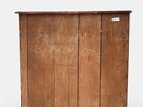 an old wooden chest with writing on the side of it