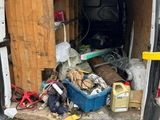 the back of a van with a lot of junk in it
