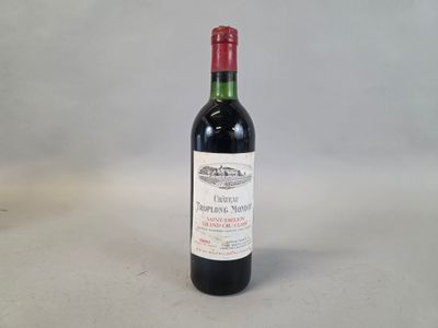 a bottle of wine that is sitting on a table