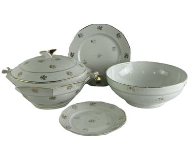 un service de table blanc et doré comprenant un bol et une soucoupe