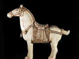a wooden horse with a harness on it ' s back