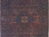 an antique persian rug with a blue and red design