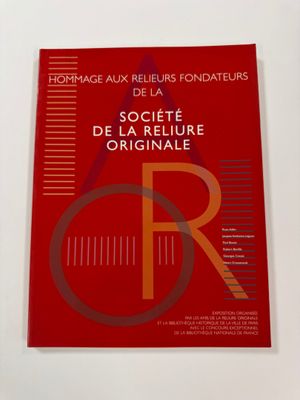 the cover of a book with a red cover and a red background