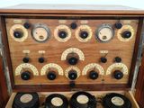 a wooden box with many different types of instruments in it
