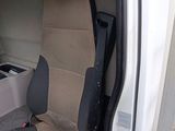 an image of the inside of a van with the door open