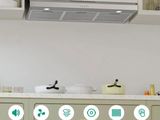 a picture of a kitchen with a range hood above the stove