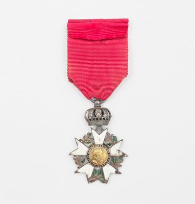 une image représentant un ruban rouge surmonté d'une étoile