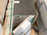 a pile of boxes and boxes on a pallet in a warehouse