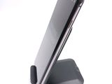 a cell phone that is sitting on top of a stand