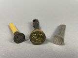 a close up of three different types of screws on a table