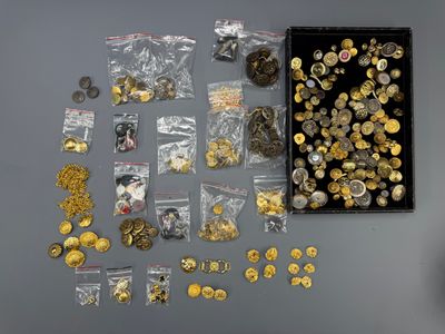 a box filled with lots of gold and silver coins