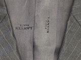 a close up of a suit with a tie on it