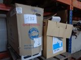 boxes are stacked on a pallet in a warehouse with a price tag on them
