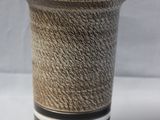 a black and white vase with a rope wrapped around it