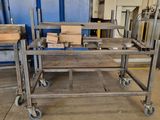 a table with a bunch of boxes on it in a warehouse