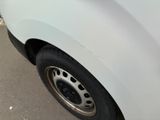 a white van parked on the side of the road