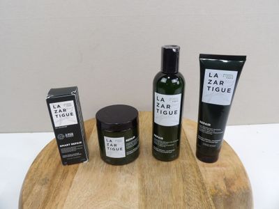 three bottles of body care sitting on a wooden tray