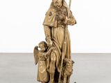 an image of a statue of a man with a child and a dog