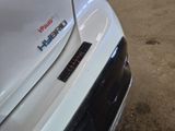 a close up of a car ' s bumper with a sticker on it