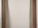 a close up of a picture frame on a wall with a white background