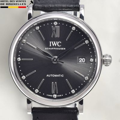 an image of a close up of a wrist watch on a white surface
