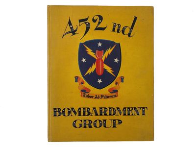 an old book with a picture of the emblem of a bombardment group