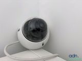 a white camera sitting on top of a white counter