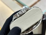 a person holding a watch in their hand