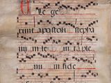 a close up of a manuscript with writing on it
