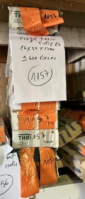 a pile of orange bags with writing on them