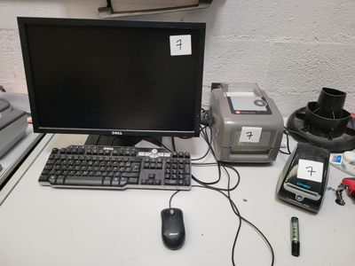 a computer monitor, keyboard, mouse, and other electronics on a desk