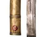 an old knife with a brass handle next to a smaller knife with a brass handle