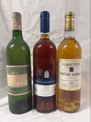 three bottles of wine sitting next to each other on a table