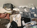 a pile of clothes and bags on the floor