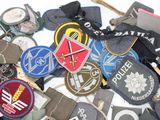 many different types of luggage tags on a white surface