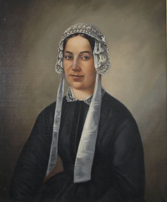 portrait of a woman in a black dress with a white head scarf