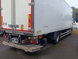 two trucks that are parked next to each other