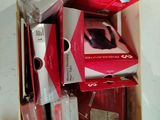 many boxes of electronic devices stacked on top of each other