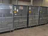 many metal boxes that are stacked up in a warehouse