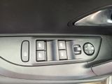 a close up of a car ' s door handle and control panel