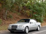 a silver car that is driving down the road