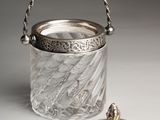 a silver plated ice bucket with a lid and handle