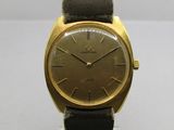 une image d'une montre-bracelet en or avec un bracelet en cuir marron