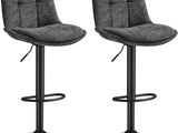 une paire de tabourets de bar gris avec des pieds en métal noir
