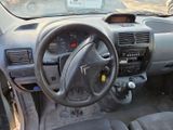 a dashboard of a car with a steering wheel and dashboard controls